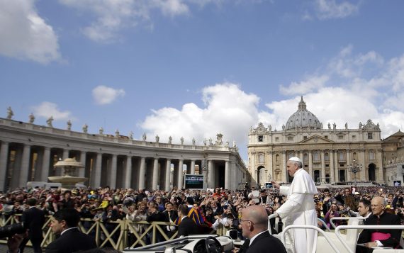 Pope Francis waves to faithful as he is driven through the crowd with his popemobile in St. Peter's Square prior to the start of his weekly general audience at the Vatican, Wednesday, April 10, 2013. (AP Photo/Gregorio Borgia)